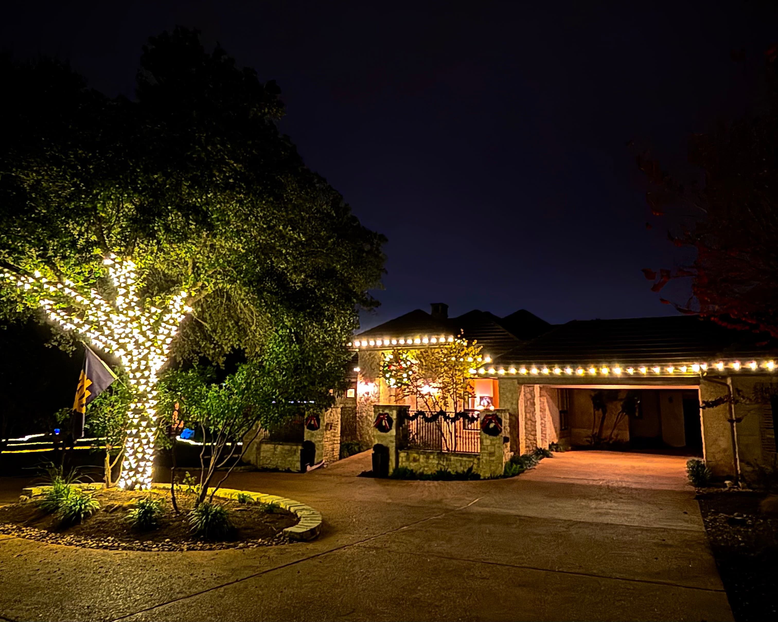 Intown Atlanta home at twilight with warm white roofline lights